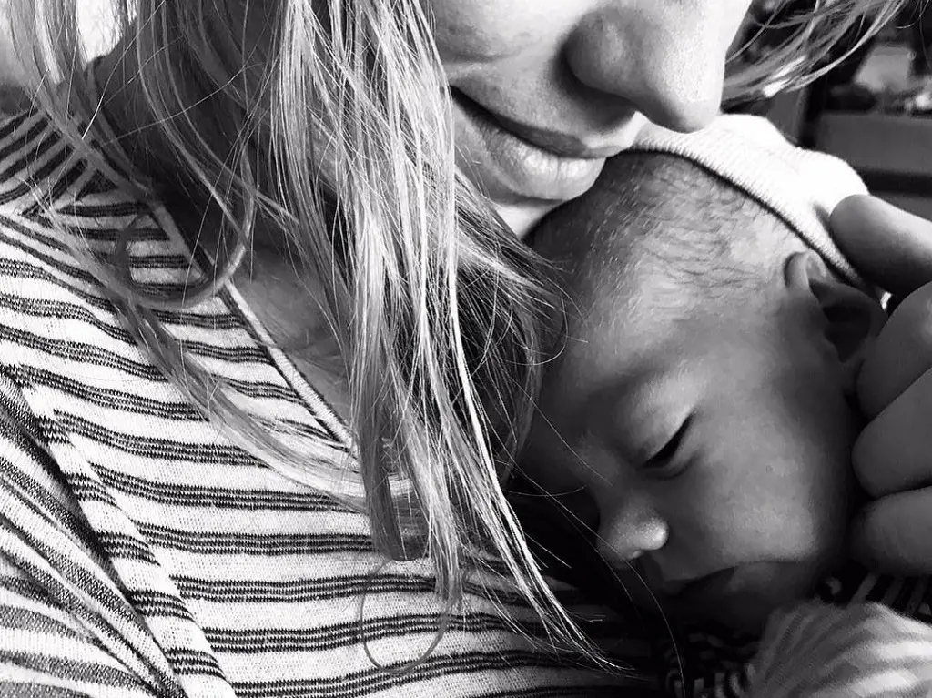 Yvonne Strahovski holding her first son William in her arms