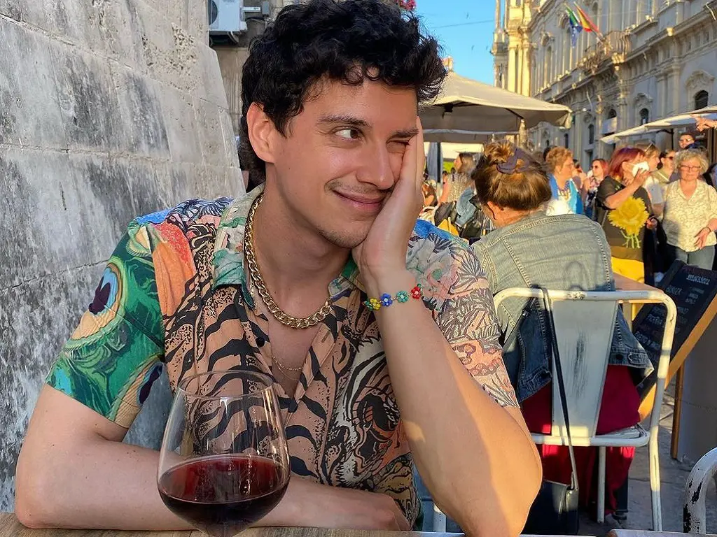 Adam DiMarco enjoys a drink in Italy.