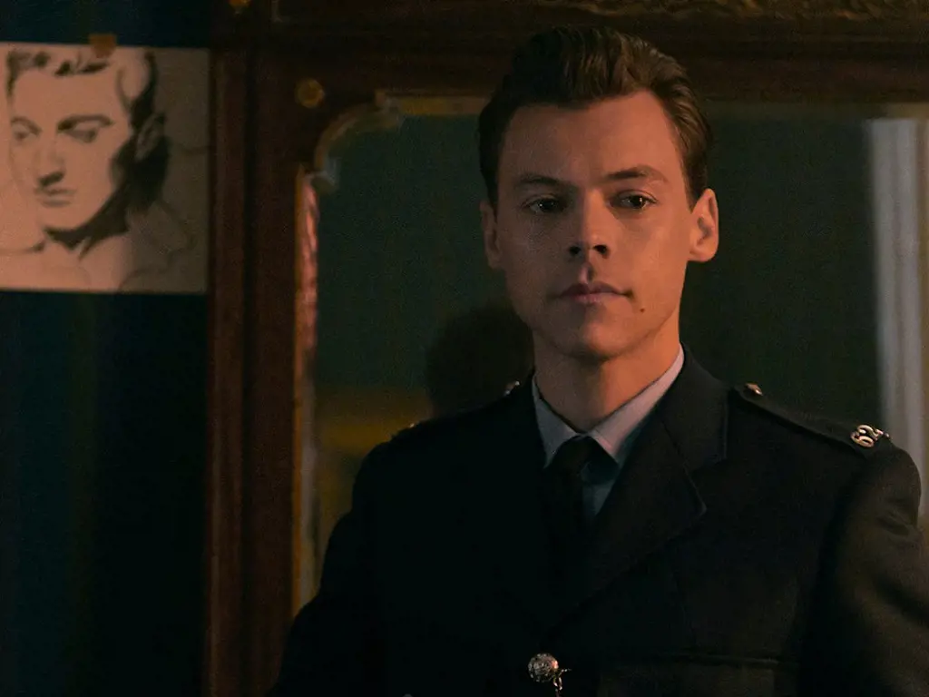 Harry Styles looks tidy and smart in uniform in one of the scenes from My Policeman.