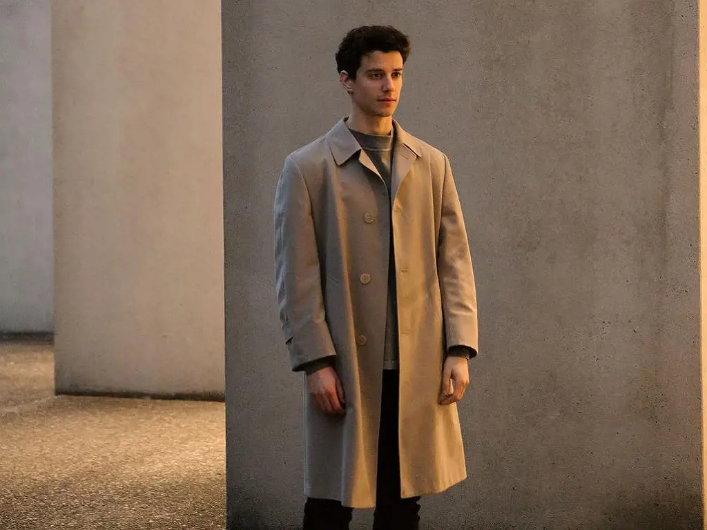 Adam DiMarco looks dashing in a trench coat on one of his Instagram posts.