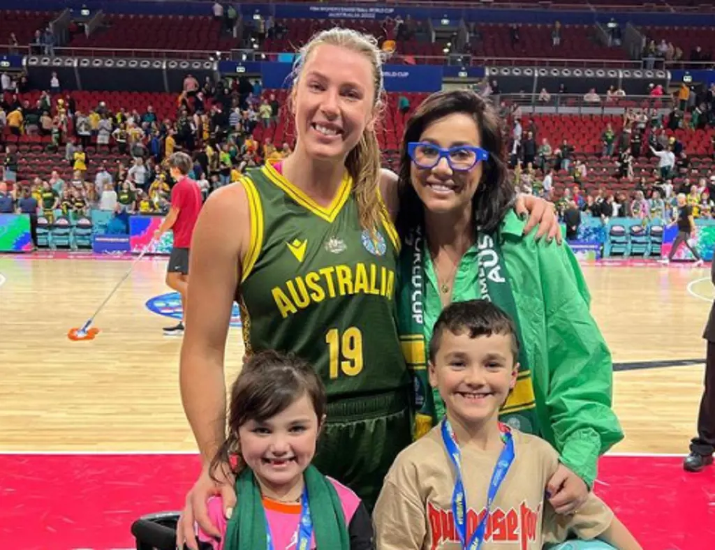 Sophie Shaw with her two children posing with Sara Blicavs