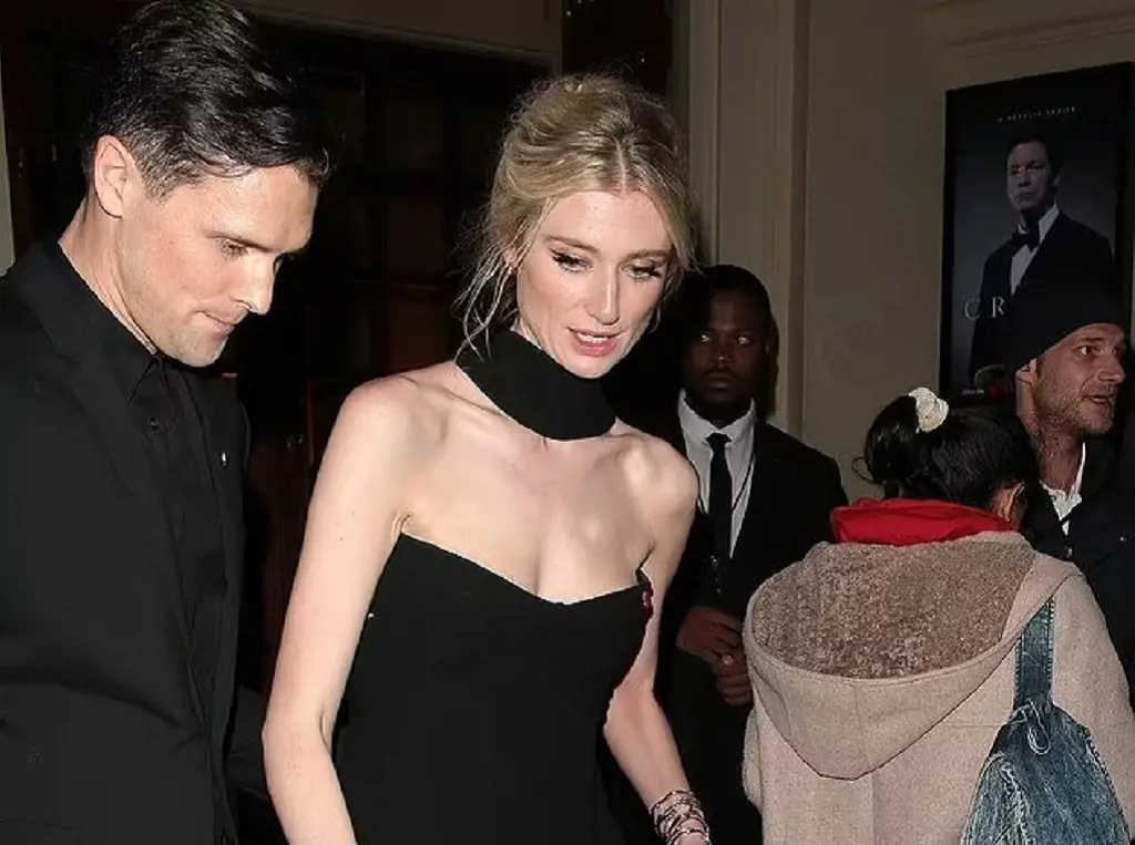Elizabeth Debicki and Kristian Rasmussen stay close on the red carpet at The Crown after-party