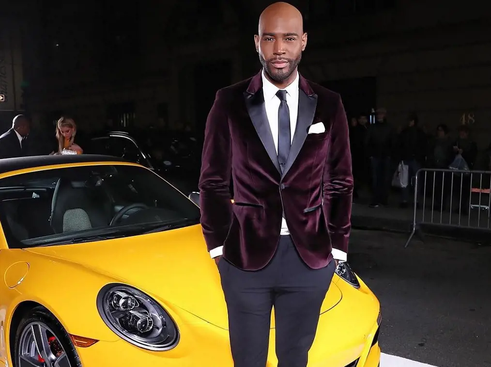 Reality icon Star Karamo as he poses in front of a Lamborghini