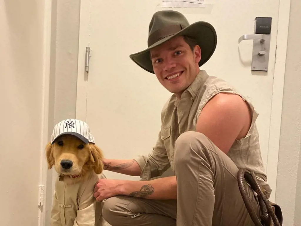 Dominic Sherwood along with his dog.