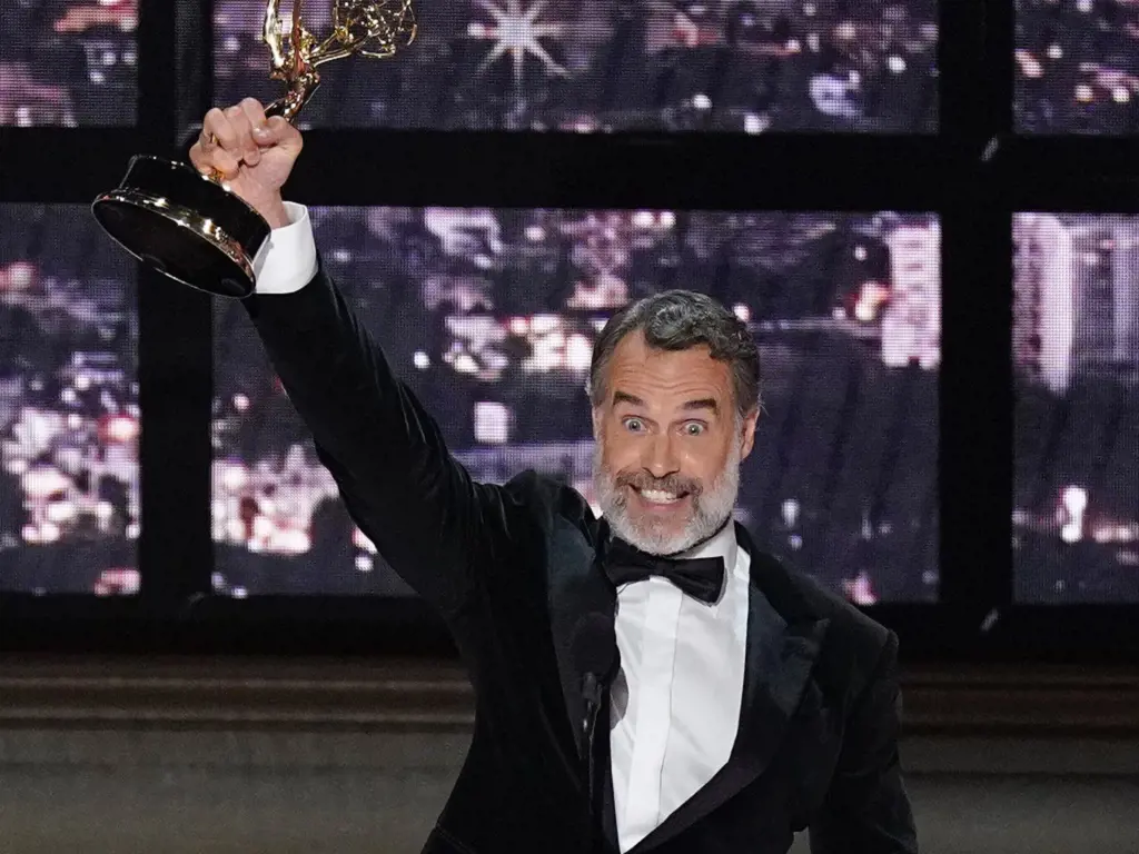 Murray Bartlett holding the Emmys award for Outstanding Supporting Actor in a Limited or Anthology Series or Movie