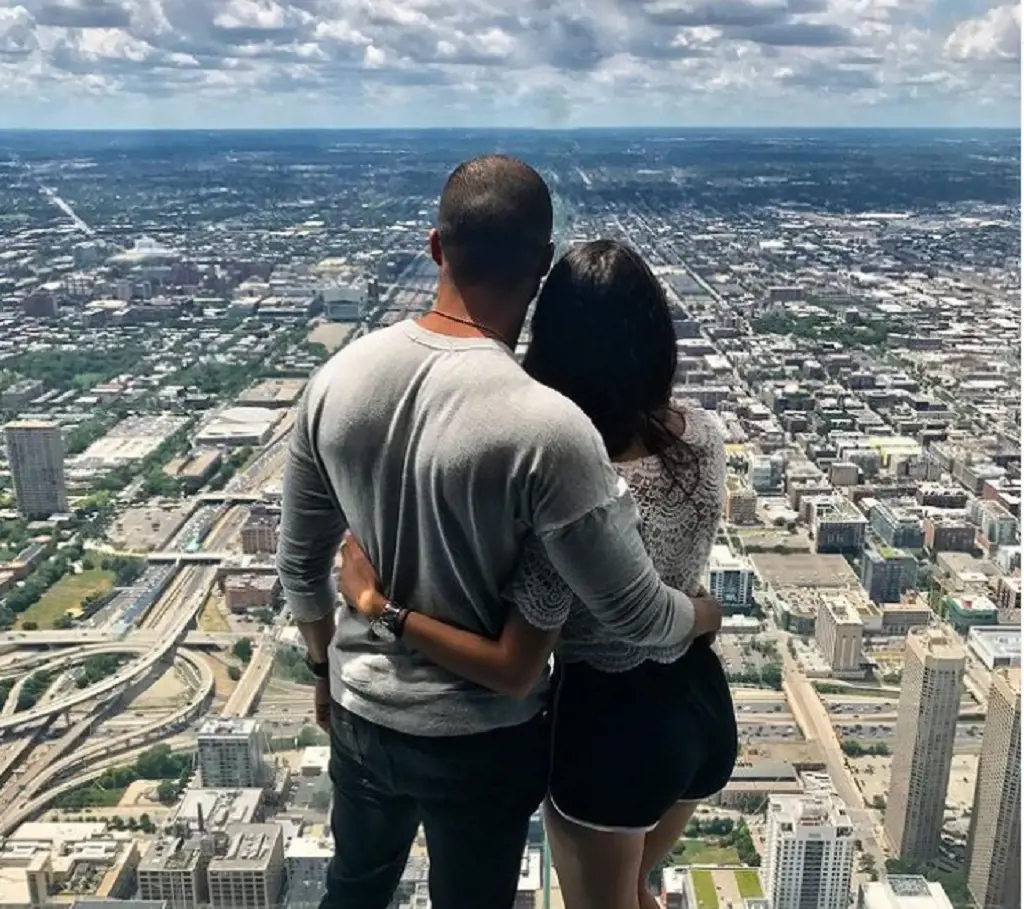 Ray and Eilyn in a sky scraper while they were out for traveling