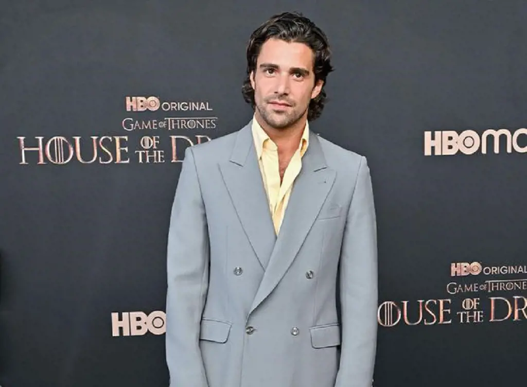 Fabien Frankel is a style king and looks handsome in his loose tailored grey suit with a pastel yellow shirt