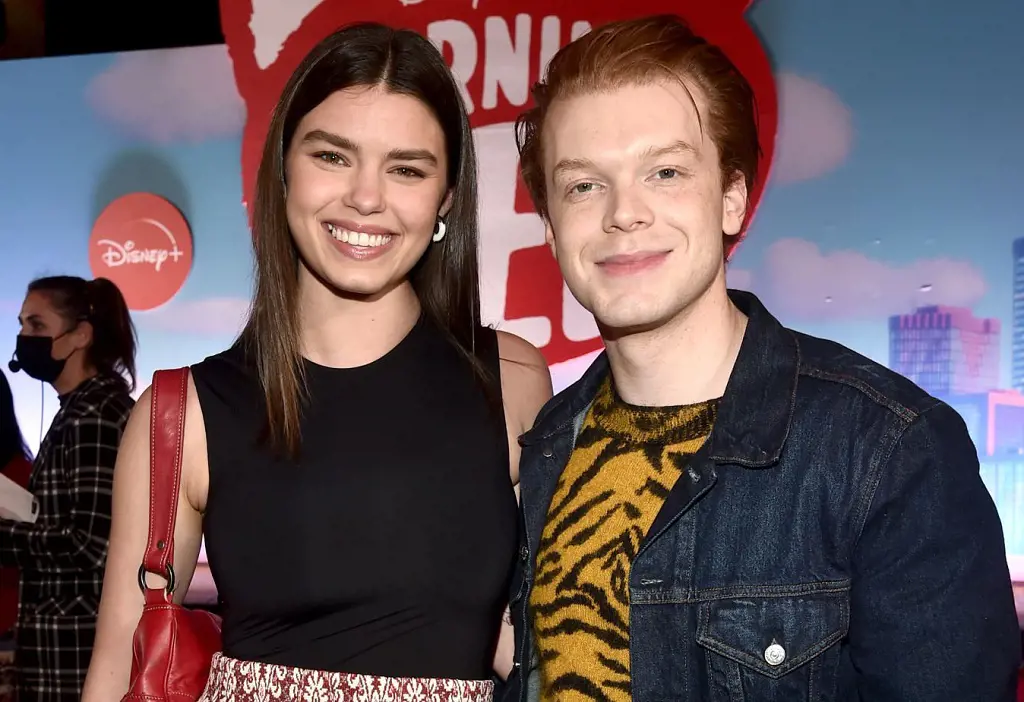 Lauren Searle and Cameron Monaghan pose together in the world premiere of Disney and Pixar's Turning Red at El Capitan Theatre in Hollywood, California on March 01, 2022 