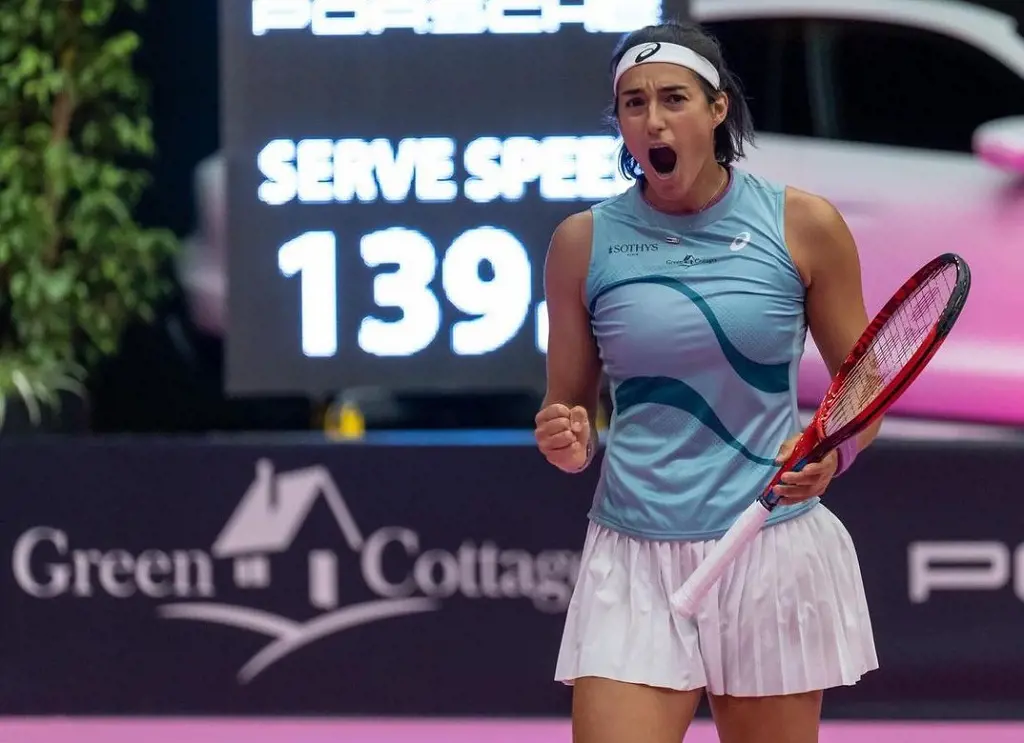 the French tennis player, Caroline Garcia playing tennis in a tournment, she is wearing Asics sponsored clothes, along with her Yonex's racket