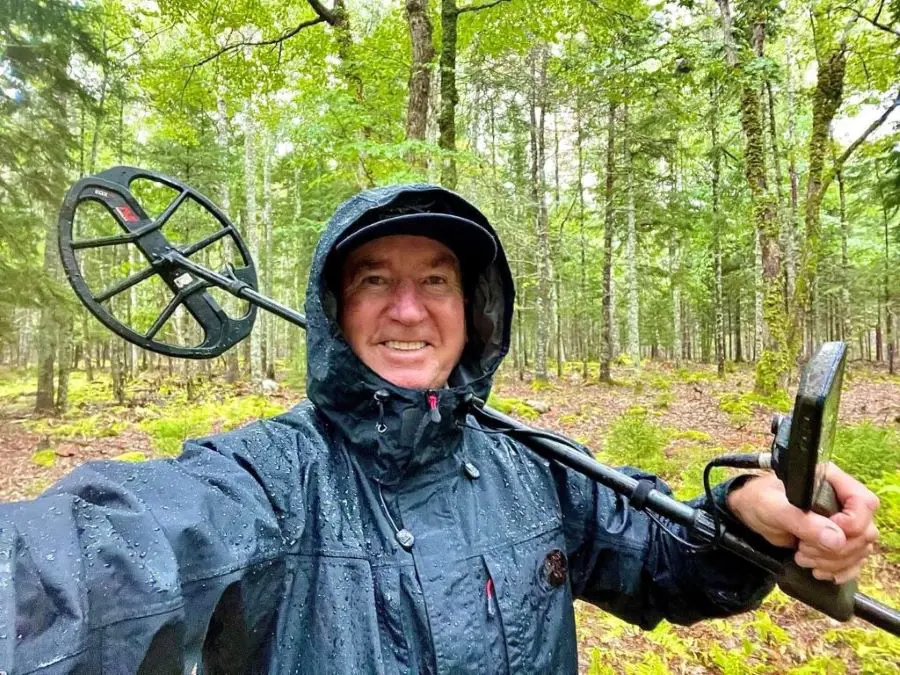 The metal detecting expert out in the rain in hopes of finding artifacts