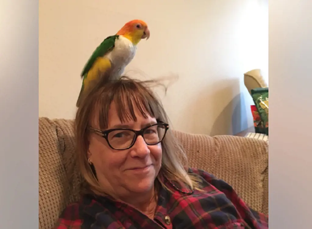Marie Kuhnla With Pet Parrot
