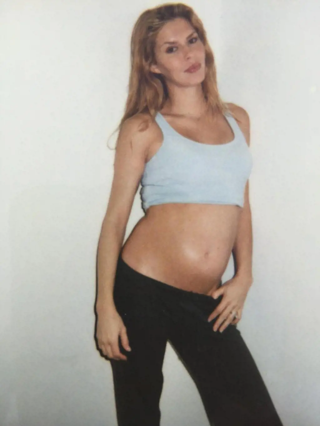 Brandi Glanville posing with her baby bump during her first pregnancy.