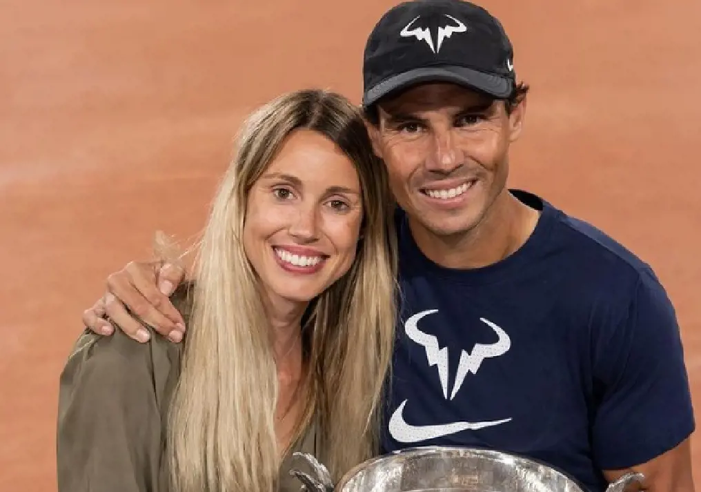 Mariable and her brother Rafeal Nadal holding a trophy