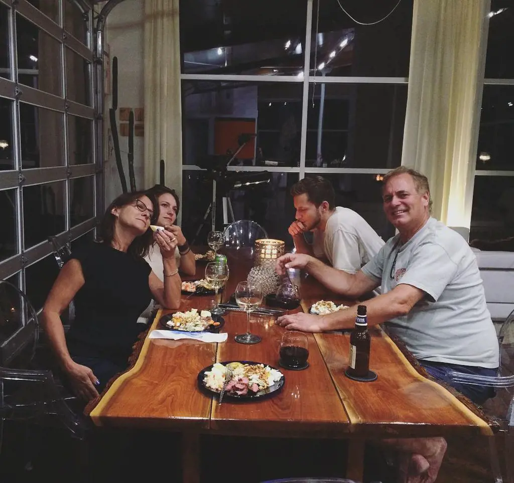 Erich Schwer having dinner with his family during a trip.