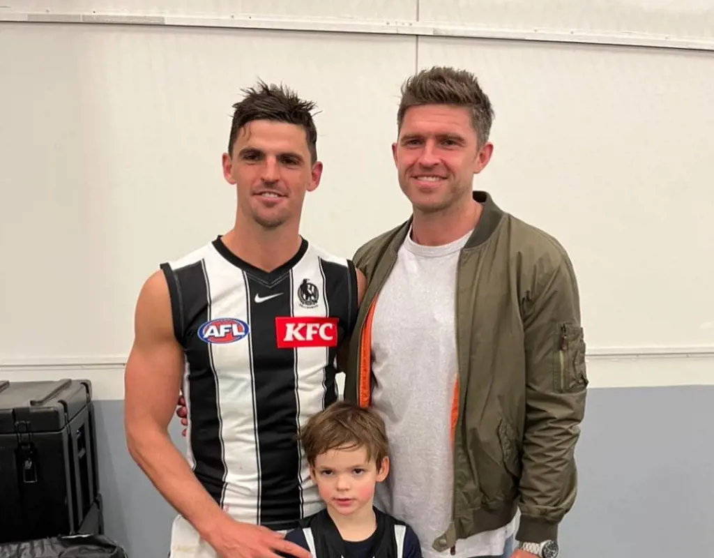 Scott Pendlebury with his brother Kristopher Pendlebury and five years old son Jax after the game