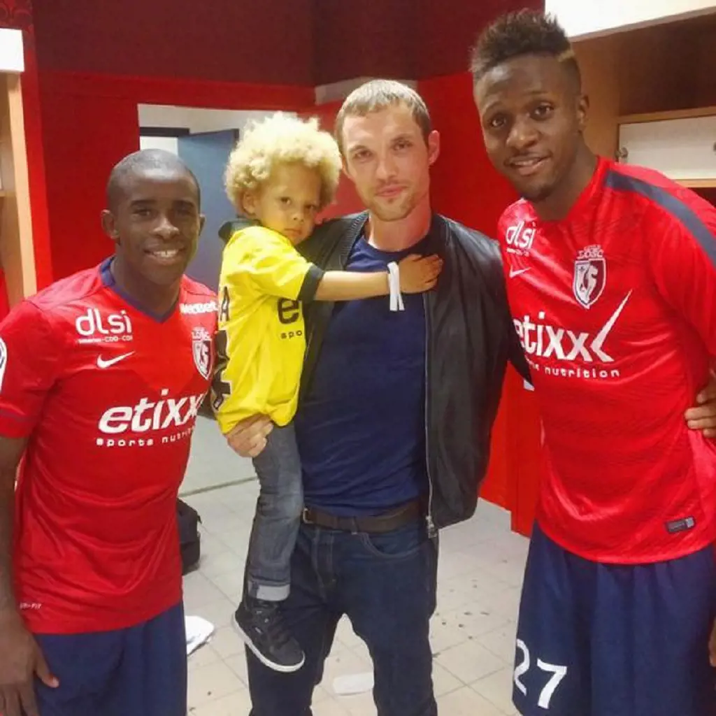 Ed SKrein with his son and two players