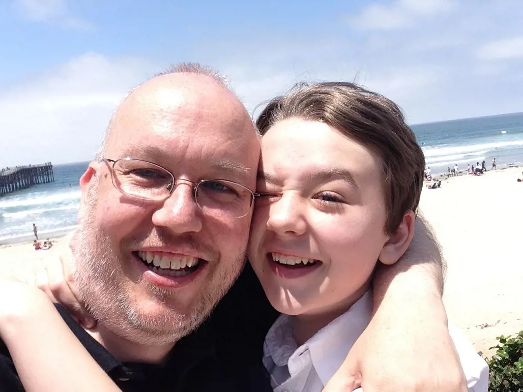 Benjamin with his dad Jim near a beach in November 2014