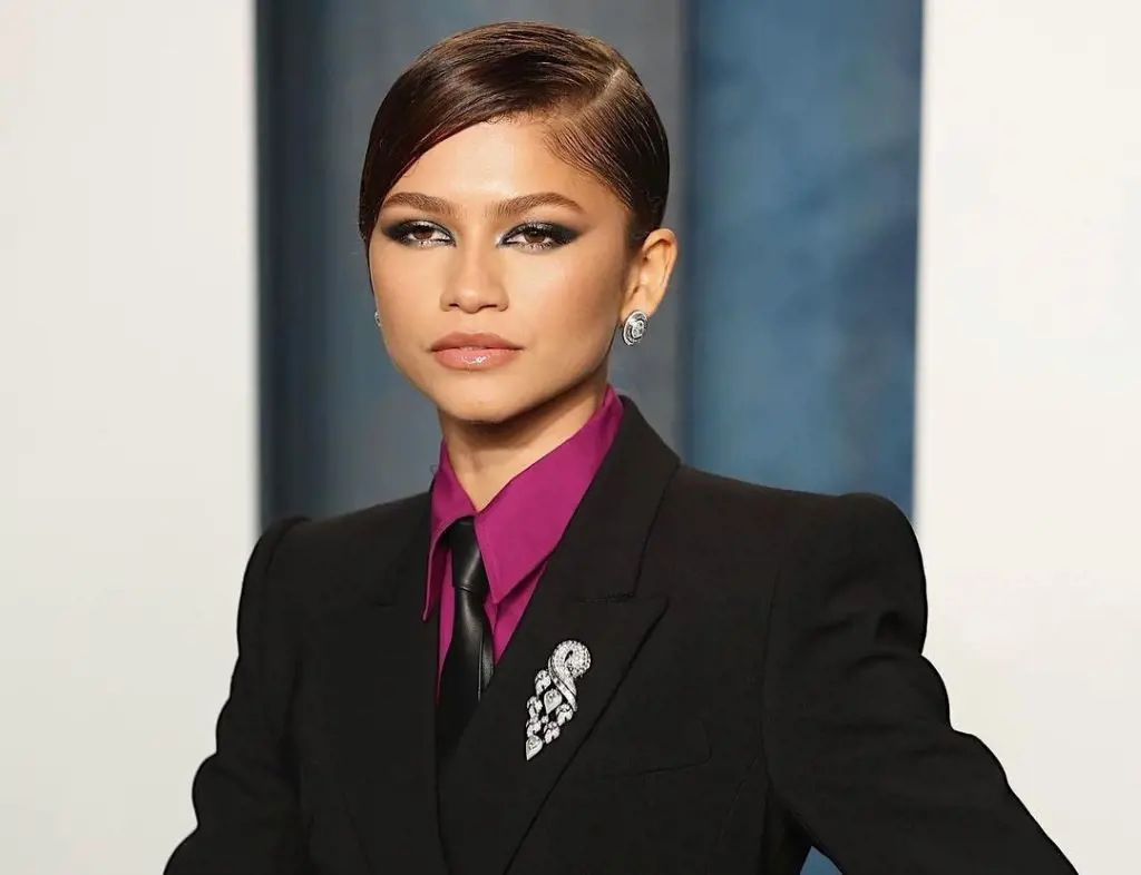 Zendaya in a double-breasted hourglass suit by Sportmax at the Vanity Fair Oscars party in March 2022