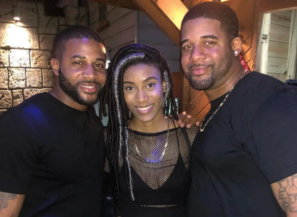  Devale Ellis(left) with younger sister, Tori Ellis, and, football coach brother, Brian Ellis(right)