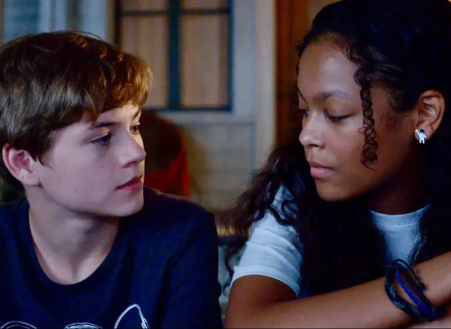 Griffin and Harper from Secrets of Sulphur Springs looking at each other; they first met at the school in the fictional Louisiana town of Sulphur Springs