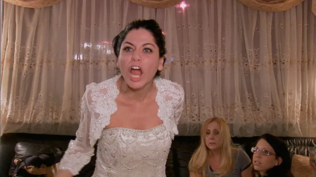Karen wearing a Bridal dress and shouting during the Bridezilla shoot and later went on to demolish her own bouquet