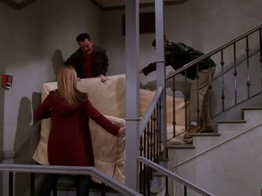 Ross tries to get his new sofa into his apartment