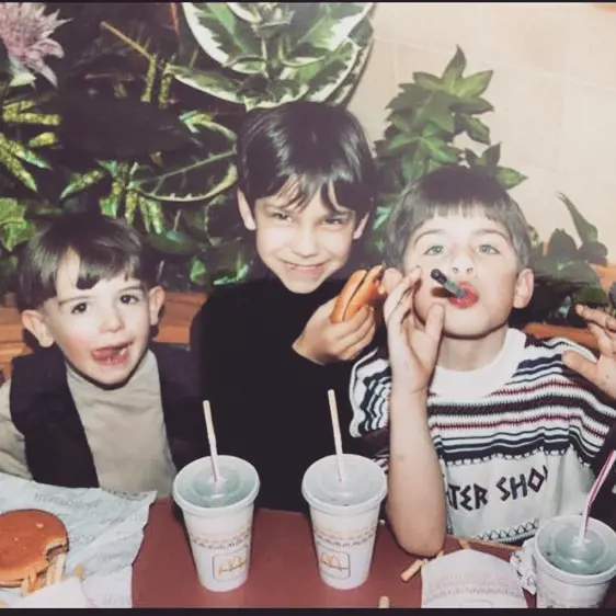 He with his cousins having McDonald burger