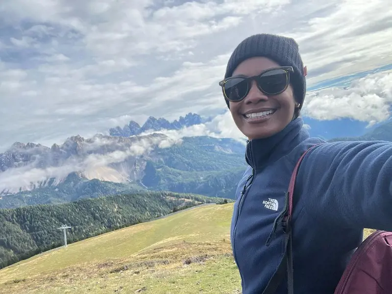 Robinne Lee hiking around the trails of a mountain in Bressanone, Trentino-Alto Adige, Italy